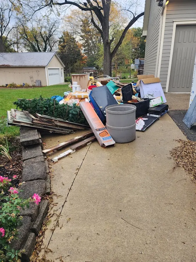 Dumpster being loaded with debris for Residential Dumpster Rental in Peotone